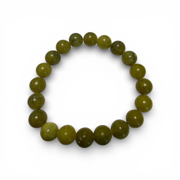 A circular stretch bracelet featuring polished round stone beads in a unique olive-mustard yellow-green hue.
