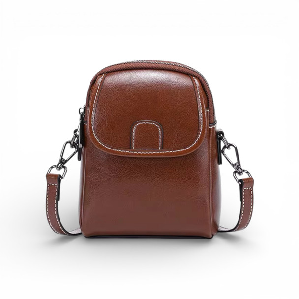 Front view of the New Generation dark espresso mini crossbody bag in genuine cow leather, featuring a rich deep brown tone and triple-zipper design.