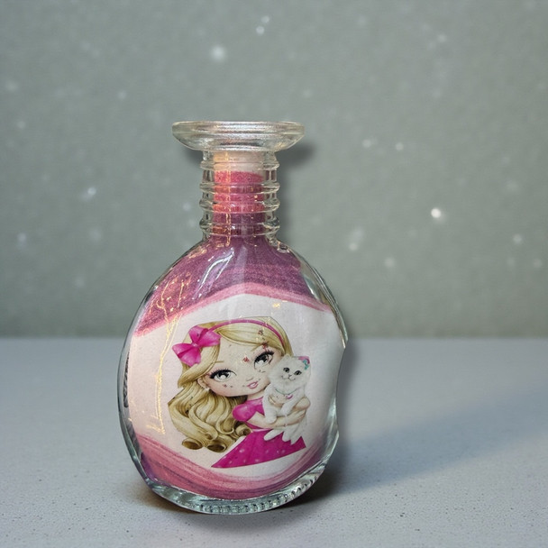 A 13 cm glass bottle featuring layered purple and white sand with a cute pink bunny character in the center.