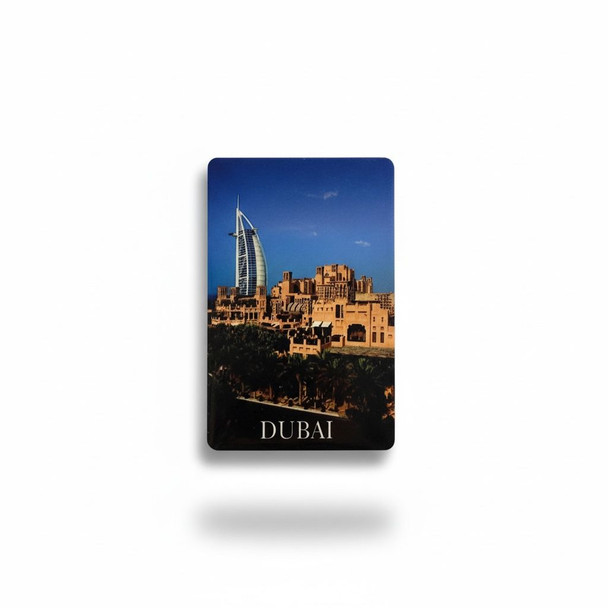 Close-up view of the crisp, glossy photographic finish on the panoramic skyline magnet, showcasing the vibrant colors and sharp architectural details of the resort waterfront.
