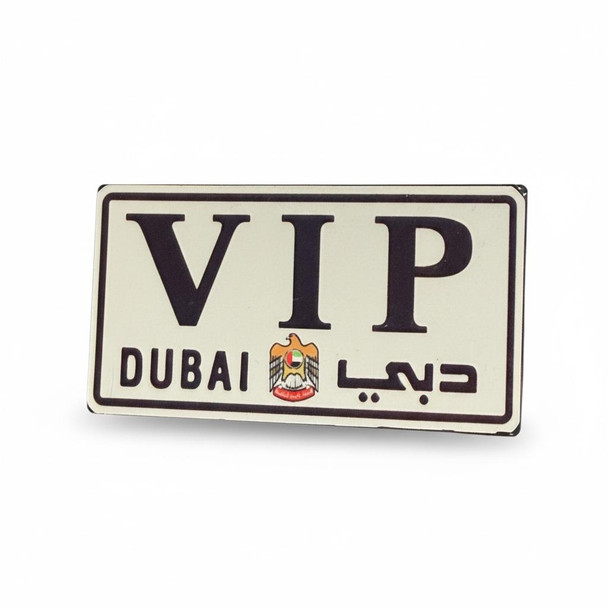 A 7x3.5 cm aluminum fridge magnet designed as a luxury Dubai VIP license plate.