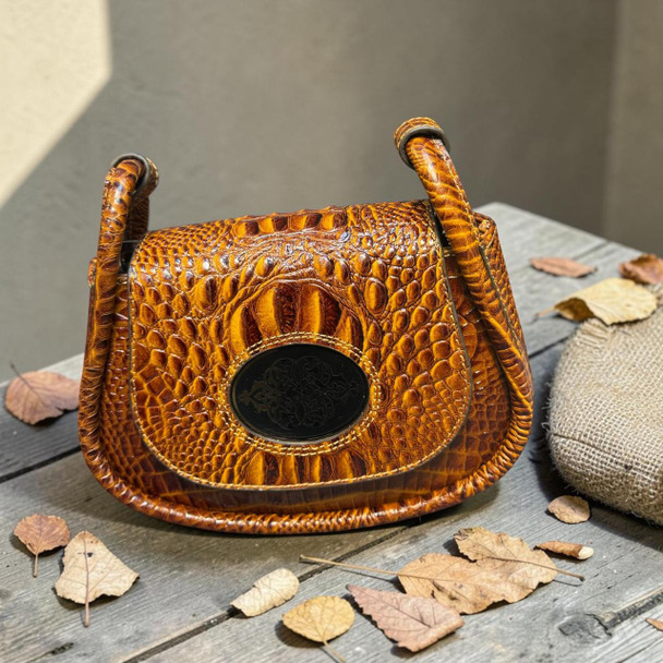 Elegant boutique presentation of the 24x19 cm genuine natural leather handbag with straps, serving as an elite personal luxury statement piece or a high-end designer gift.