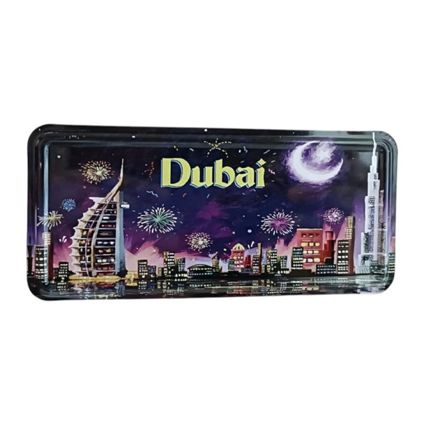 A rectangular printed metal magnet featuring a magical nighttime view of Dubai with celebratory fireworks display.