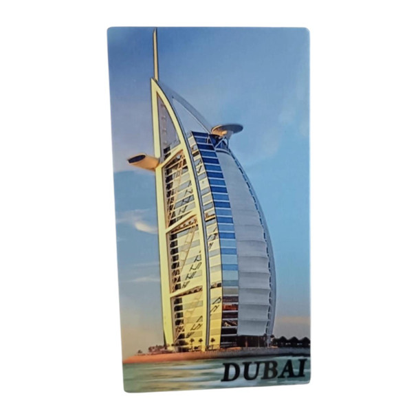 A vertical 14x8 cm aluminum fridge magnet displaying the Burj Al Arab architectural landmark under a clear blue sky with "DUBAI" text at the base.