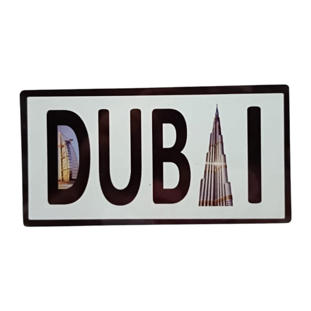 A high-quality aluminum plate magnet from Craftihouse, showcasing Dubai’s iconic architecture creatively embedded within its name.