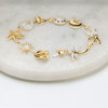 14kt Gold Lab Sapphire and Diamond Multi Charm Bracelet