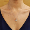 Silver Fish Pearl Pendant Adorned With White Crystal