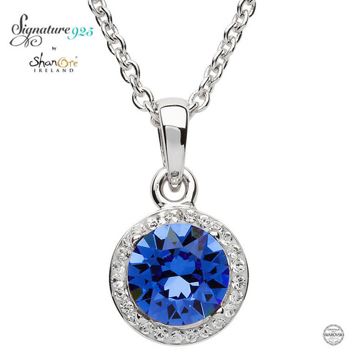 Round Silver Halo Pendant Adorned With Sapphire and White Crystals