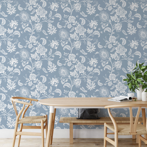 A gorgeously illustrated vintage floral wallpaper featuring white ornamental flowers set against a blue background. Great for a bedroom or living room feature wall.