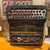 Bottom view of the vintage Corona portable manual typewriter showing the original metal base, feet, and underside construction.
