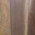Close-up of planed oak and walnut boards side by side, showing the open grain of the tan oak and the darker, fine-grained walnut