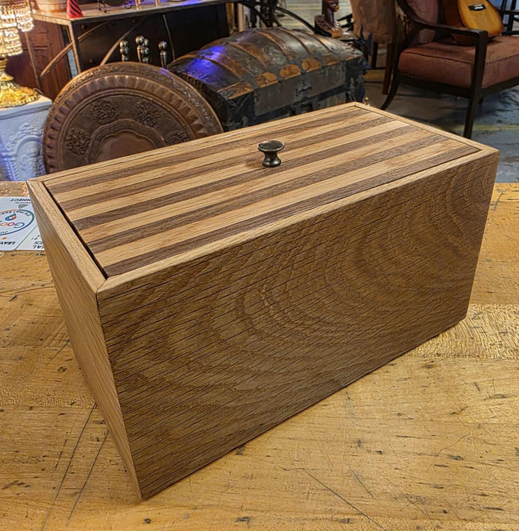 Handcrafted oak and walnut wood box with striped laminated lid and dark metal knob