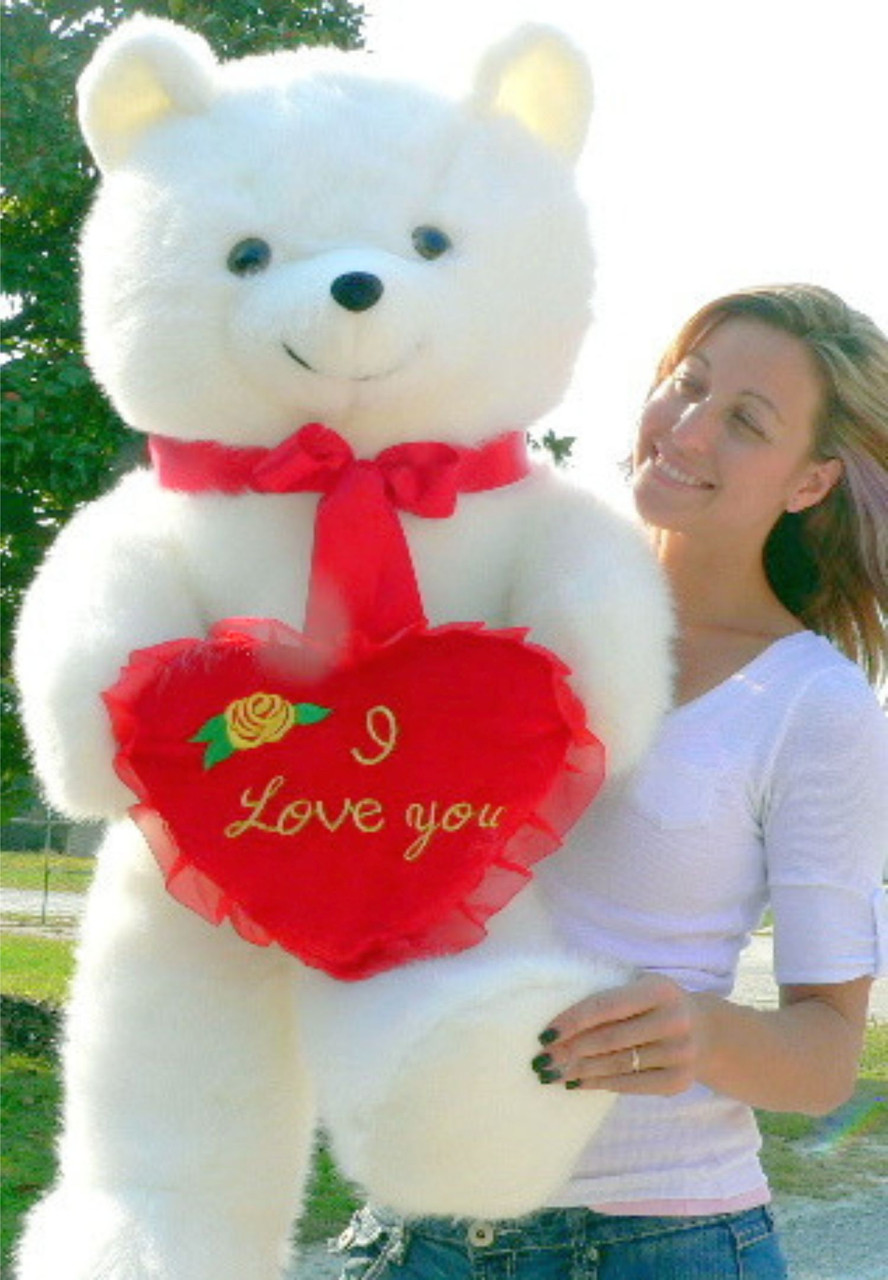 Ours en peluche XXL blanc avec coussin en forme de coeur