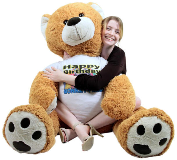 Giant Happy Birthday Teddy Bear 55 Inches Honey Brown Color Wears Tshirt that says HAPPY BIRTHDAY MONKEY FACE