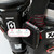Close-up of the battery control module mounted on a ski boot strap, highlighting the 3 temperature level indicator lights for the XCMAN toe warmers
