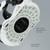 Bottom baseplate view of XCMAN 360 Seco Pro black and white snowboard bindings showing the hybrid nylon fiber base and multi-angle adjustment dial