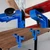Detailed close-up views of the rubber suction cups and tightening knobs on the XCMAN aluminum ski and snowboard vise