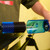 Practical view showing how to attach or align the detachable safety shield onto the roto brush axle and handle assembly