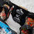 Action shot of the XCMAN anti-slip spike stomp pad mounted on a snowboard between bindings in snowy conditions