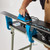 Overhead perspective of the XCMAN waxing iron evenly applying wax across a wide snowboard surface