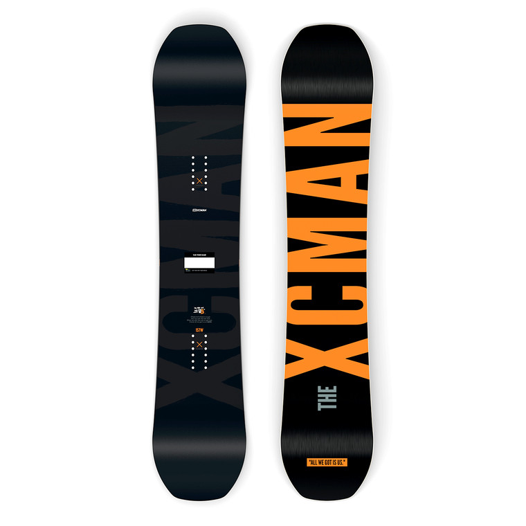 XCMAN Men's Ember Nocturne Freeride Snowboard shown from both top and bottom views, featuring a matte black topsheet and a vibrant orange base with large "THE XCMAN" branding