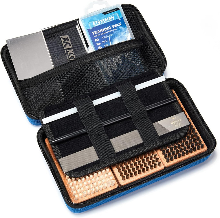 Open view of the XCMAN Ski and Snowboard Waxing and Tuning Kit showing organized tools neatly packed inside the travel storage bag