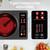 Sonifer SF-3065 2000W infrared cooker with black ceramic plate, sensor touch panel and steel side handles next to its retail box – electric cooker Lebanon