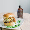 pulled pork sandwich with Maple Cayenne bottle