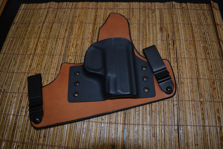 Shown here in Standard black 0.080 Kydex and a natural leather back trimmed with black, completed with adjustable steel clips.