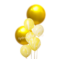 Marble yellow and orbz balloon bouquet