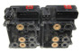 The ones with TRACS have 7 pistons (seen on the left), the ones without have 6 (seen on the right).