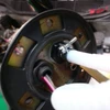 Close-up of the in-tank side of a JBtuned Honda fuel pump hanger upgrade showing fitting clearance and the factory sealing gasket.