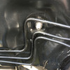 Close-up of the JBtuned stainless-steel clutch-line bulkhead fitting installed through the firewall of an EF Civic, CRX or DA Integra K-swap.