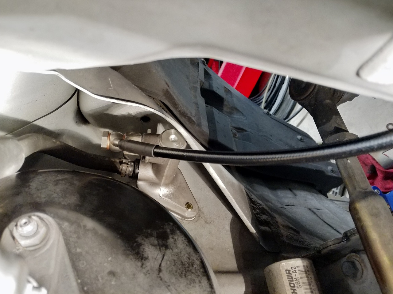 Close-up of JBtuned RSX DC5 clutch line connected at the OEM clutch master cylinder.