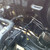 Installed JBtuned EF/DA K-swap hydro clutch line showing the engine-bay side of the stainless-steel firewall bulkhead connection.