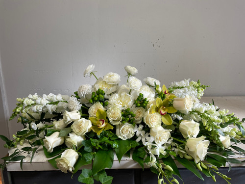 White and green casket spray