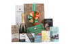 Gourmet gift basket featuring Taittinger Brut Réserve Champagne paired with sweet and savoury snacks (chocolate, crackers, nuts, etc.), packaged in signature Green & Green gift box with ribbon and bow.