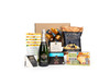 Gourmet gift box featuringSegura Viudas Cava Brut Reserva sparkling wine paired with sweet and savoury snacks (chocolate, crackers, nuts, etc.), packaged in signature Green & Green gift box with ribbon and bow.