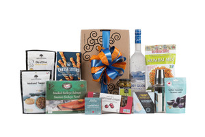 Gourmet gift box featuring Grey Goose vodka, a martini shaker, and snacks (crackers, cheese, pate, etc.). Gourmet gift box featuring Grey Goose vodka, a martini shaker, and snacks (crackers, cheese, pate, etc.).