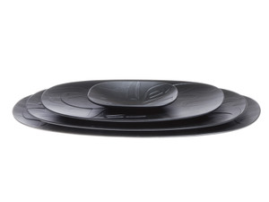 Four black oval nesting platters, etched with a West Coast First Nations abstract design. Four black oval nesting platters, etched with a West Coast First Nations abstract design.