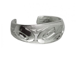 Wide silver bracelet, etched with a West Coast First Nations abstract design. Wide silver bracelet, etched with a West Coast First Nations abstract design.