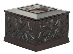 Black recycled glass box carved with maple leaf design. Black recycled glass box carved with maple leaf design.