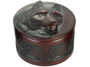 Round rosewood box carved with a wolf design. Round rosewood box carved with a wolf design.