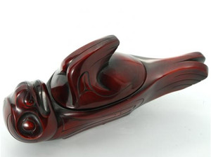 Rosewood spirit box carved in West Coast First Nations seal design. Rosewood spirit box carved in West Coast First Nations seal design.
