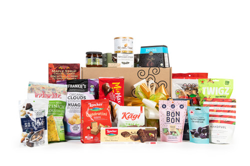 Gourmet gift basket featuring sweet and savory snacks (chocolate, cookies, crackers, nuts, etc.) packaged in signature Green & Green gift box with yellow and green ribbon and bow.