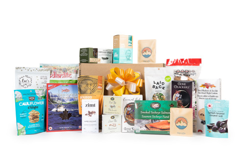 Gourmet gift basket featuring BC local snacks (chocolate, candies, crackers, smoked salmon, etc.) packaged in signature Green & Green gift box with  ribbon and bow.