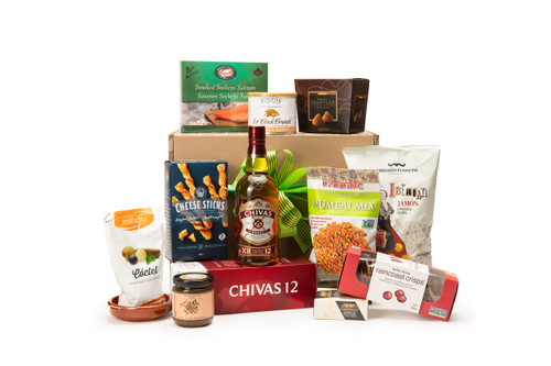Gourmet Whisky gift box featuring Chivas Regal 12 Years paired with sweet and savoury snacks (chocolate, crackers, nuts, etc.), packaged in signature Green & Green gift box with ribbon and bow.
