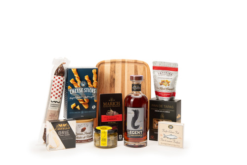 Gourmet bourbon gift basket featuring Legent Kentucky Straight Bourbon Whiskey paired with sweet and savoury snacks (chocolate, crackers, nuts, etc.), packaged in signature Green & Green gift box with ribbon and bow. 