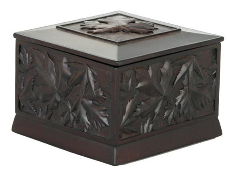 Black recycled glass box carved with maple leaf design.