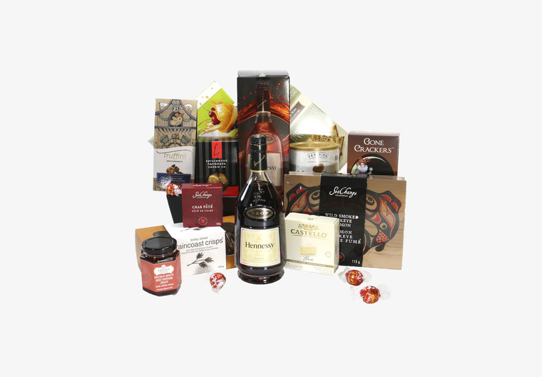 Gourmet gift basket featuring Hennessy and snacks (crackers, cheese, pate, etc.).